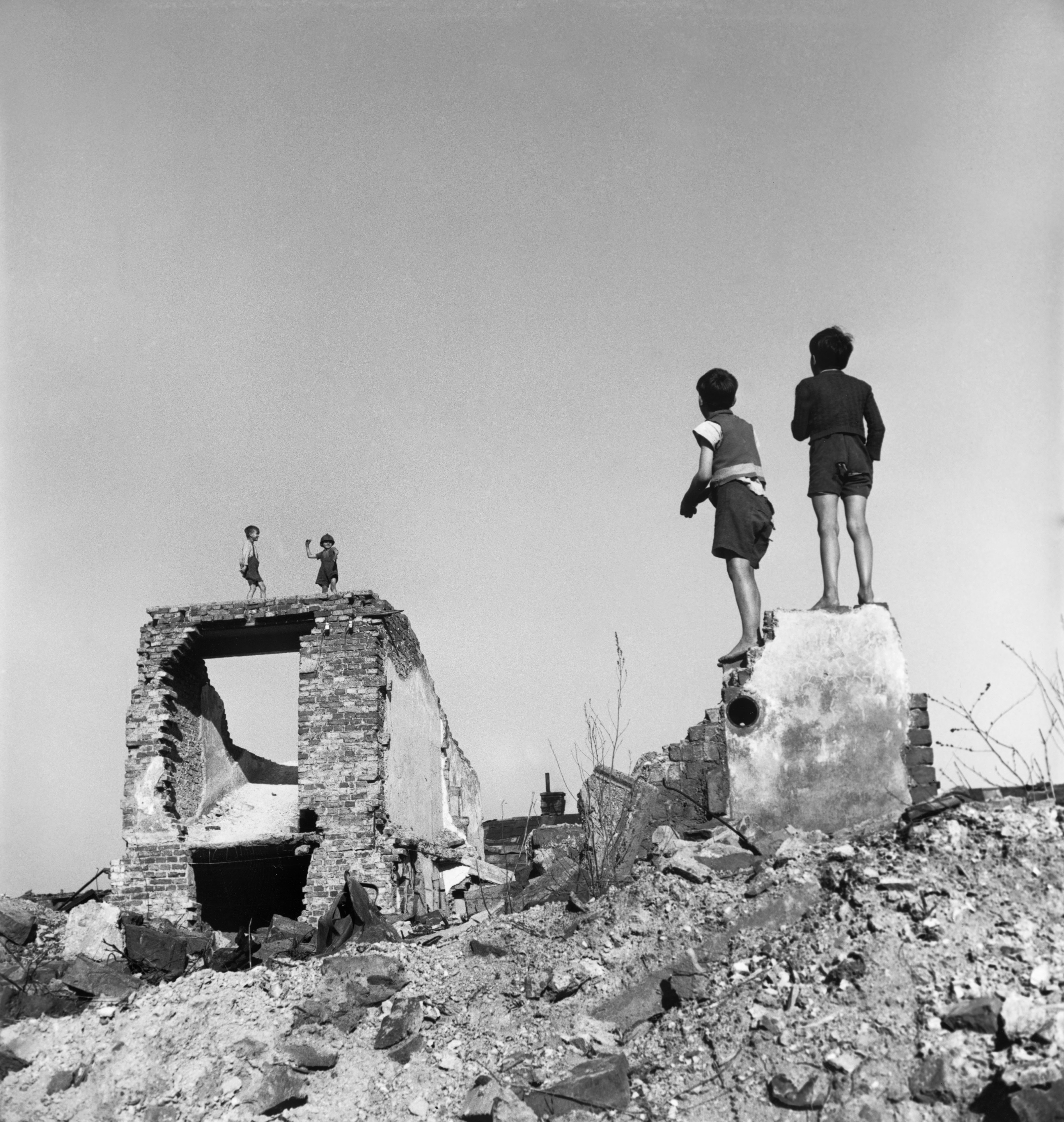 David Seymour - Boys play in bombed-out buildings. Vienna, Austria. 1948