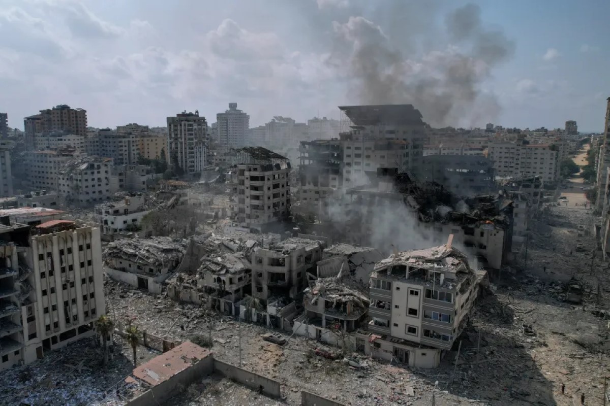 A view of the rubble of buildings hit by an Israeli airstrike, in Gaza City, Tuesday, Oct. 10, 2023.